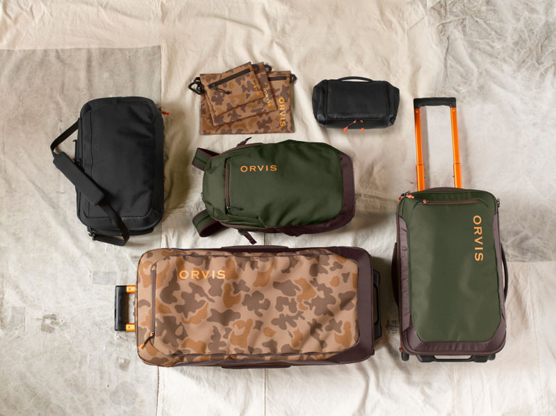 A collection of black and camo Trekkage luggage