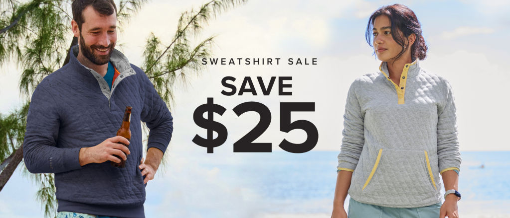 Sweatshirt Sale –Save $25! Two people stand next to each other on a tropical beach.