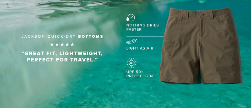 Olive shorts with text that says Jackson Quick Dry Bottoms, 5 starts, "Great fit, lightweight, perfect for travel." Descriptors next to the shorts say Nothing dries faster | Light as air | UPF 50+ protection. All on a background of turquoise water.