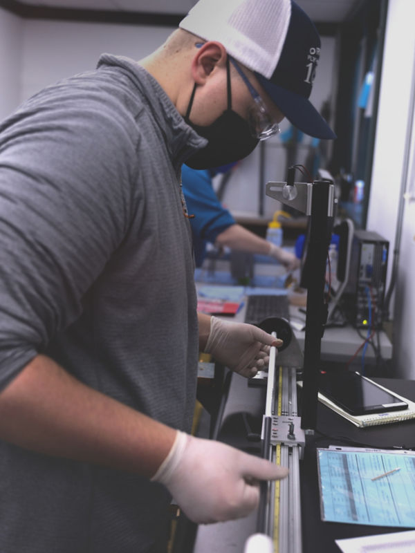 A worker at the Orvis Rod Shop working on a new fly rod.