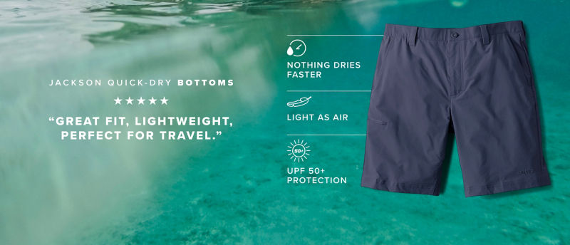 Tropical water background with Jackson Quick Dry Shorts in navy on top and the text: Jackson Quick-Dry Bottoms  ★★★★★ &ldquo;Great fit, lightweight, perfect for travel.&rdquo; Then three icons point toward the shorts with the following explanations: NOTHING DRIES FASTER, LIGHT AS AIR, and UPF 50+ PROTECTION.