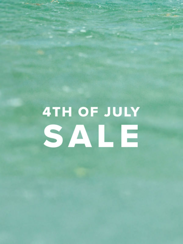 White text saying "4th of July Sale" over a background of tropical waters.