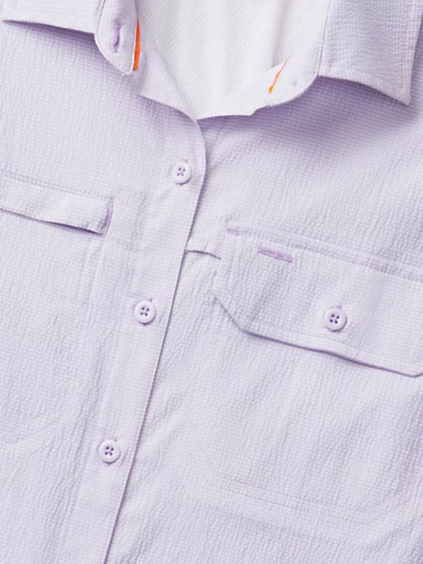 Closeup image of a lavender button down shirt.