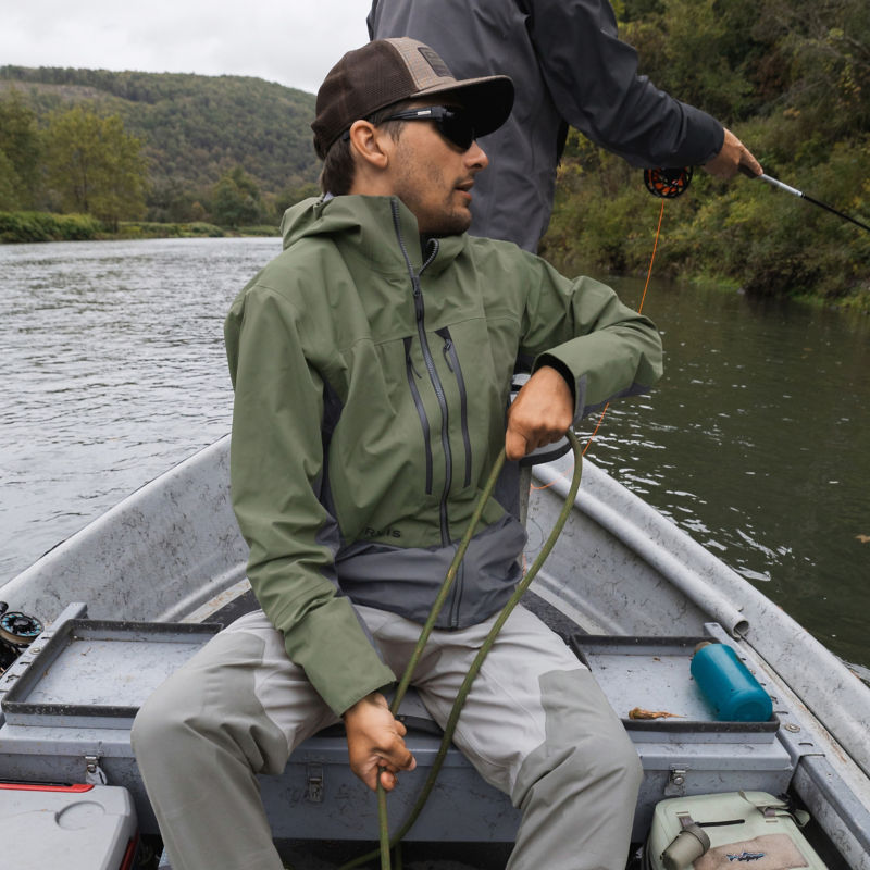 Two anglers in the back of a john boat.