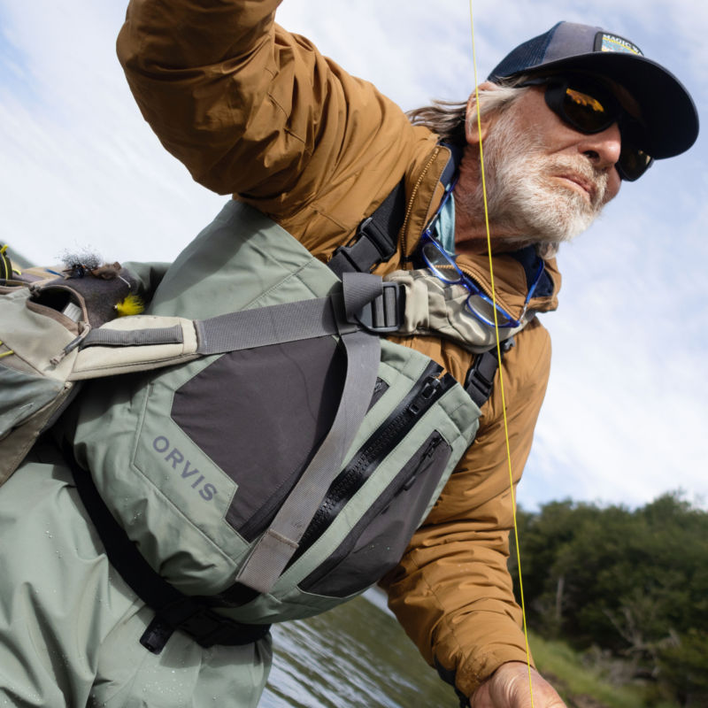 An action shot of an angler fly fishing in Clearwater Waders.