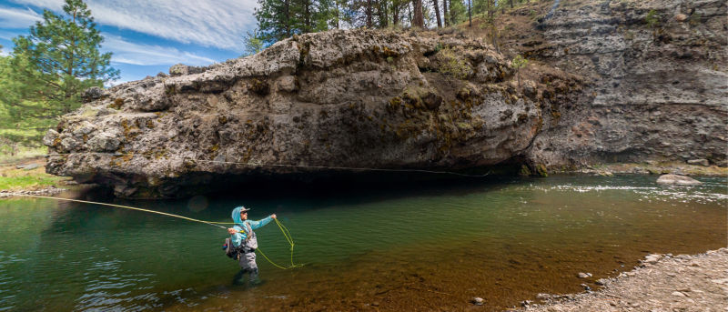 An angler casting on the Little Truckee River in California.