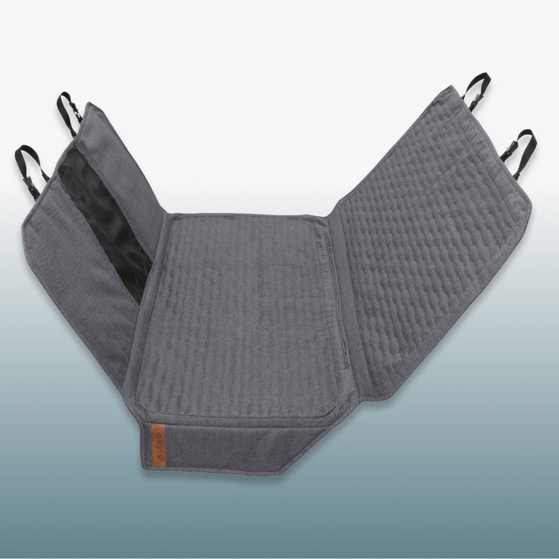 A gray backseat car protector with mesh window laid over a blue gradient background.