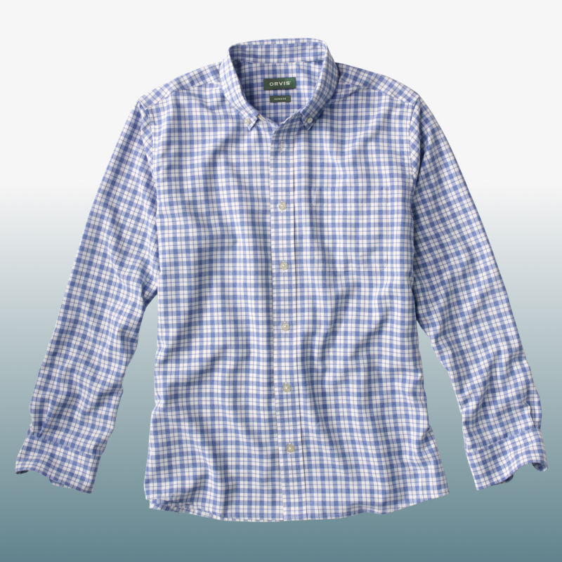 A blue plaid button-down shirt laid over a blue gradient background.