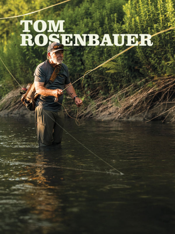 Tom Rosenbauer fishing in a quiet river.