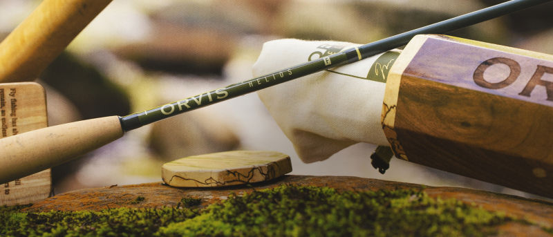 The Rosenbauer Edition Helios F 9' 4-WT Rod with a wooden rod tube.