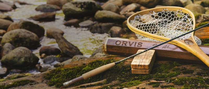 A Limited edition Helios fly rod and net from the Tom Rosenbauer 50th Anniversary collection.