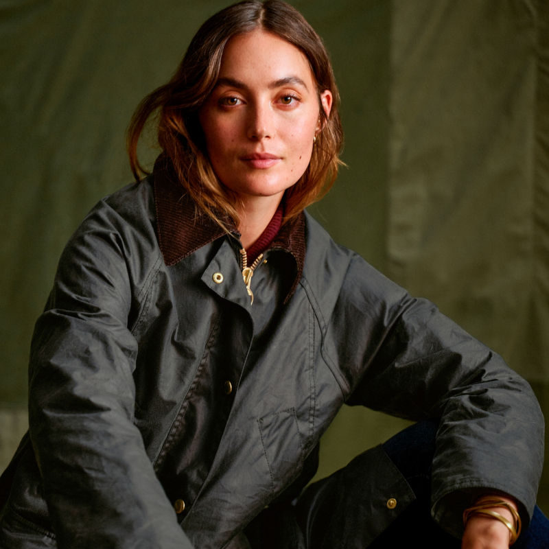 A model wearing a waxed cotton Barbour&reg; Jacket.