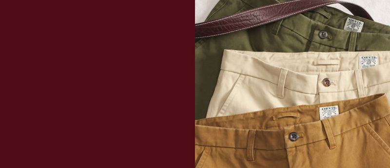 A split image of men's pants in three colors on the right and dark burgundy background on the left.