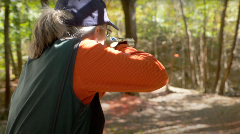 A woman shooting clays off a stand for the Orvis Cup.