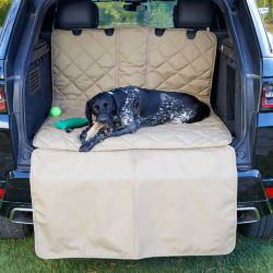 A dog laying on an Orvis Grip-Tight® Quilted Hose-Off Cargo Protector