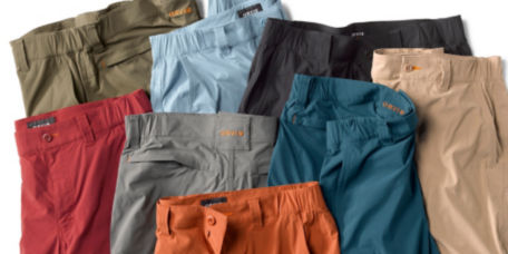 An arrangement of pants and shorts in a variety of colors