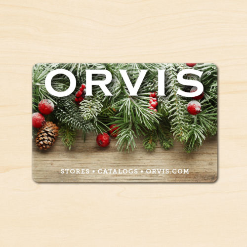An Orvis Gift Card with evergreen boughs and red berries.