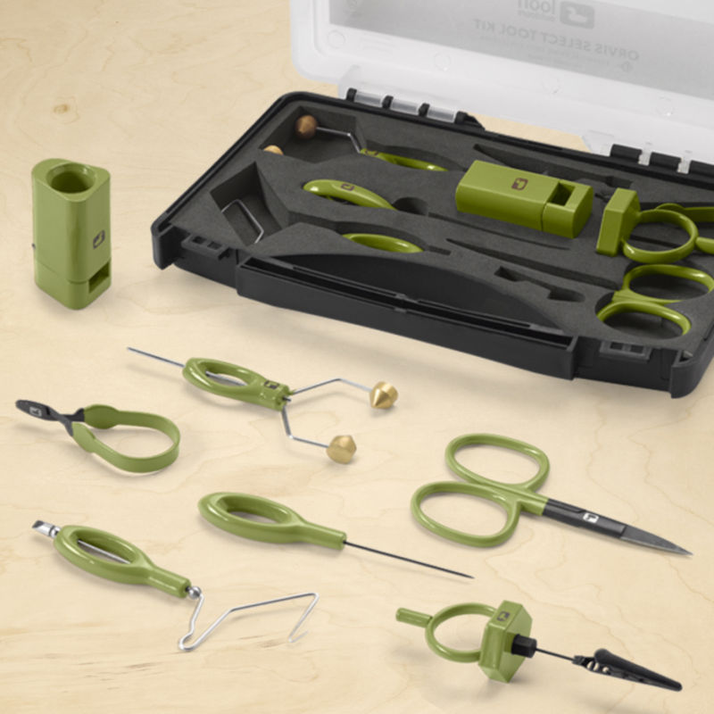 Green handled tools from a kit displayed on a table.