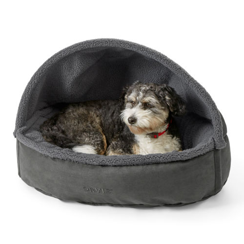 Grey burrower dog bed with a small gray and white dog