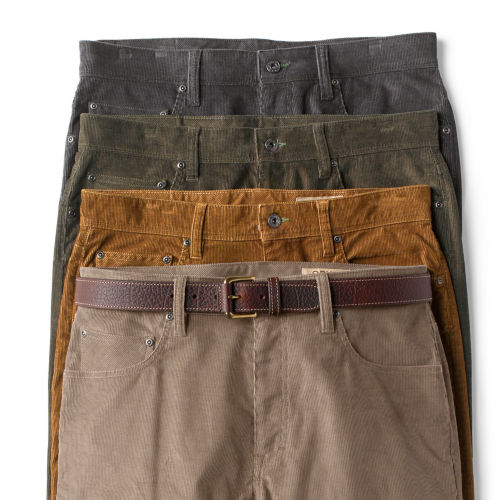 A stack of corduroy pants in 4 colors.