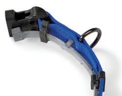 A close up on Conceal-a-Collar clips holding a flea & tick collar.