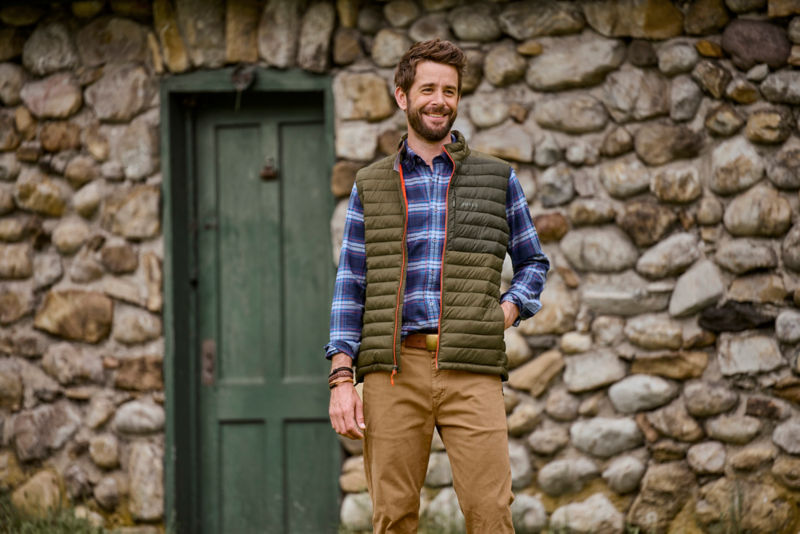 Man in Drift Vest with flannel shirt
