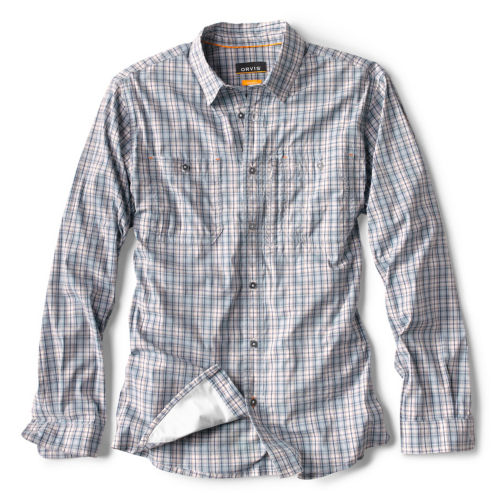 A long-sleeved, button-up shirt in a muted blue plaid