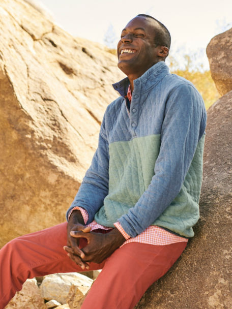 Man in 5-Pocket Stretch Twill Pants laughs in desert canyon