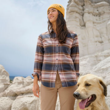 Woman in Lodge Flannel Plaid Shirt walks with her dog in a mesa.