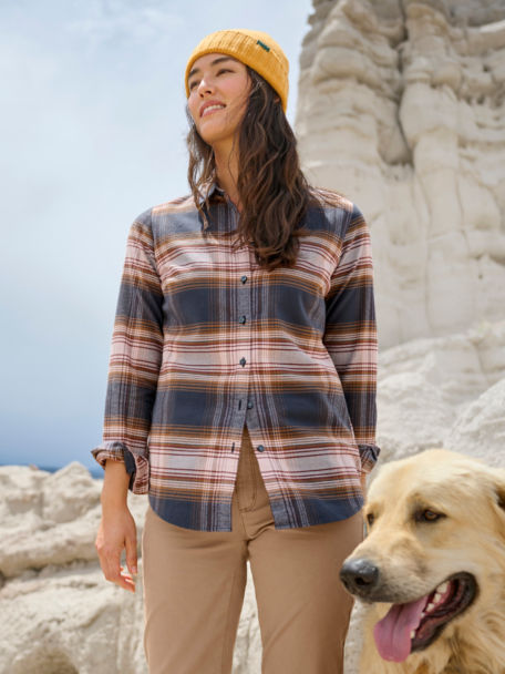 Woman in Lodge Flannel Shirt Boulders with her dog.