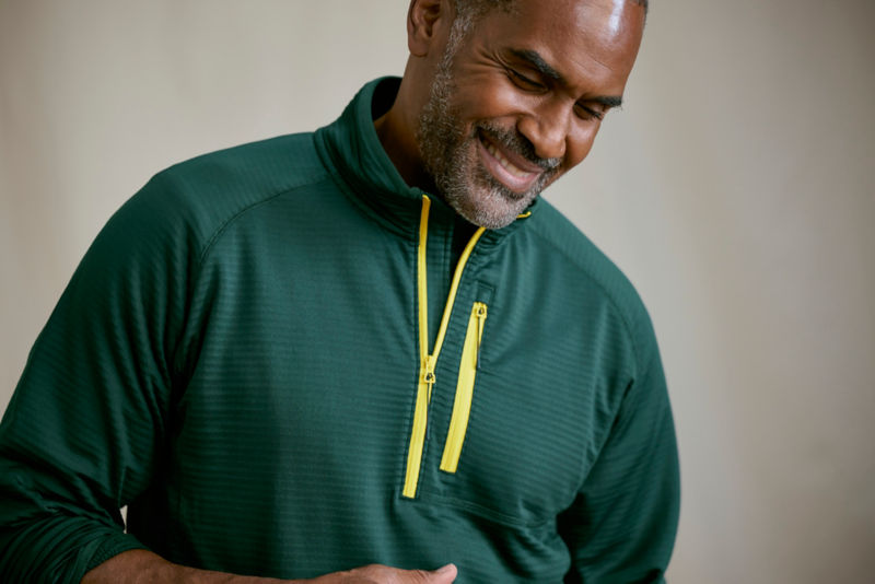 Model wearing peacock horseshoe hills 1/4 zip