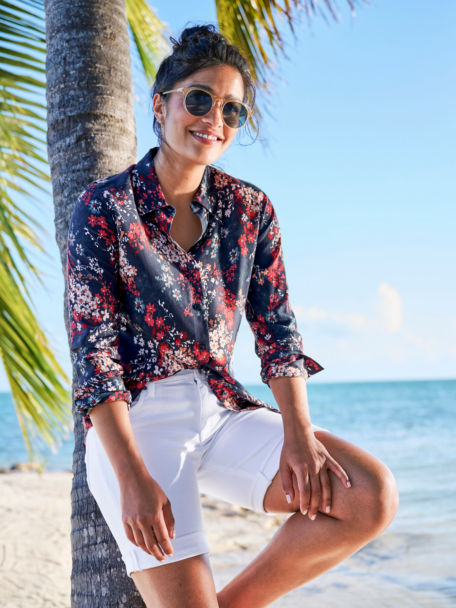 Woman in Long-Sleeved Everyday Silk Shirt leaning on palm tree
