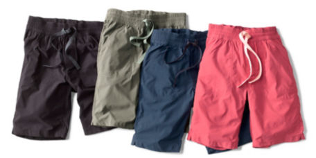Four pairs of shorts laid out on a white background
