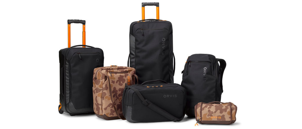 A collection of black and camo Trekkage luggage