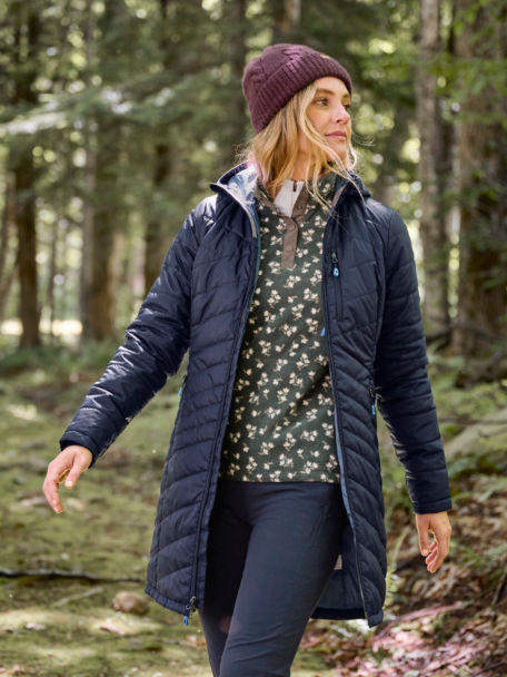 Woman in Hill Country Microfleece Quarter-Snap walking in the woods.