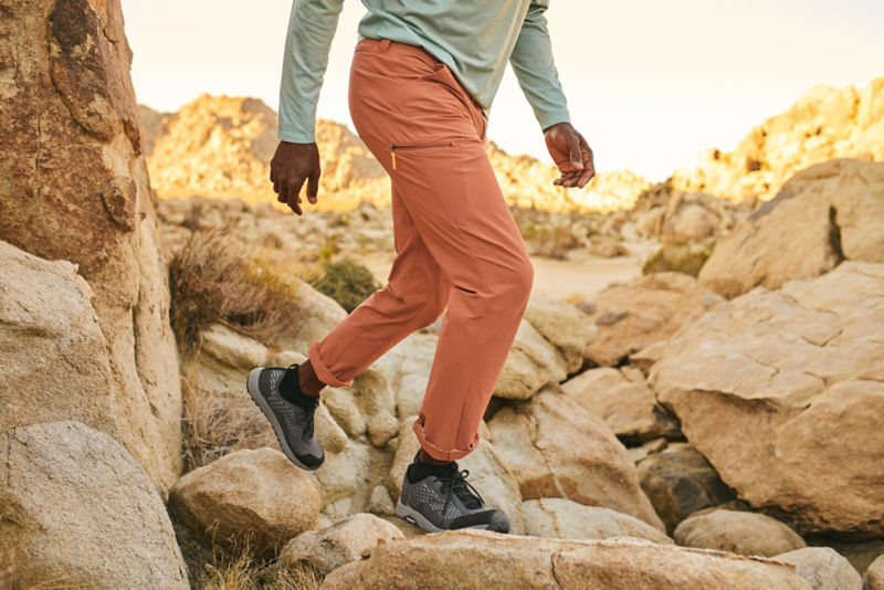 Man walks in the desert during golden hour