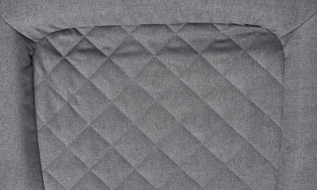 The diamond-quilted bottom of a gray RecoveryZone dog bed.