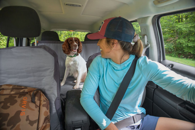 Product Developer Natalie sitting in her car with her dog