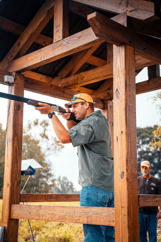 A shooter waits for a clay at Running Creek Ranch Sporting Club & Resort