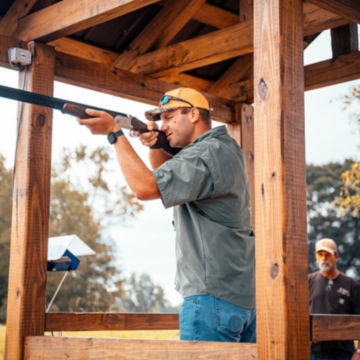 A shooter waits for a clay at Running Creek Ranch Sporting Club & Resort