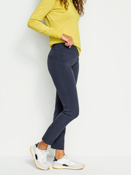 Woman in Navy Wonder Ripstop Natural Fit Ankle Pant.