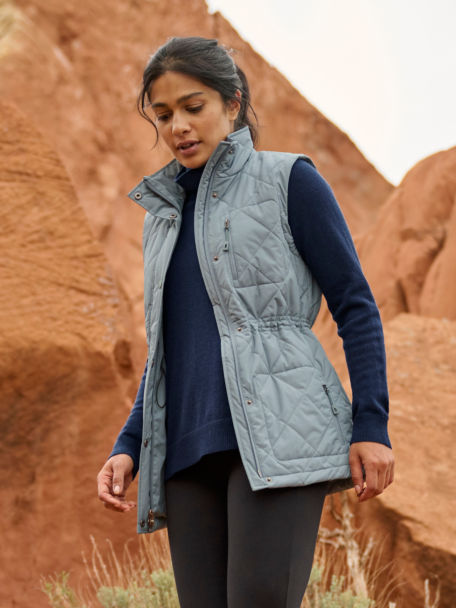 Woman in RT7 Vest, On Repeat Fitted Leggings, and Cashmere Classic T-New goes for a run on a desert trail.