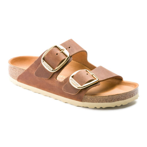 A sandal with brown leather straps
