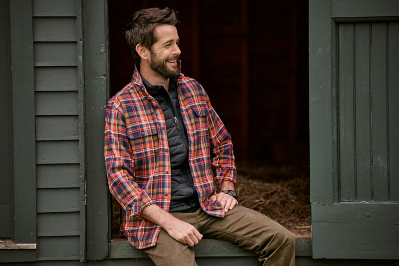 Model wearing shirt jacket with black Drift vest