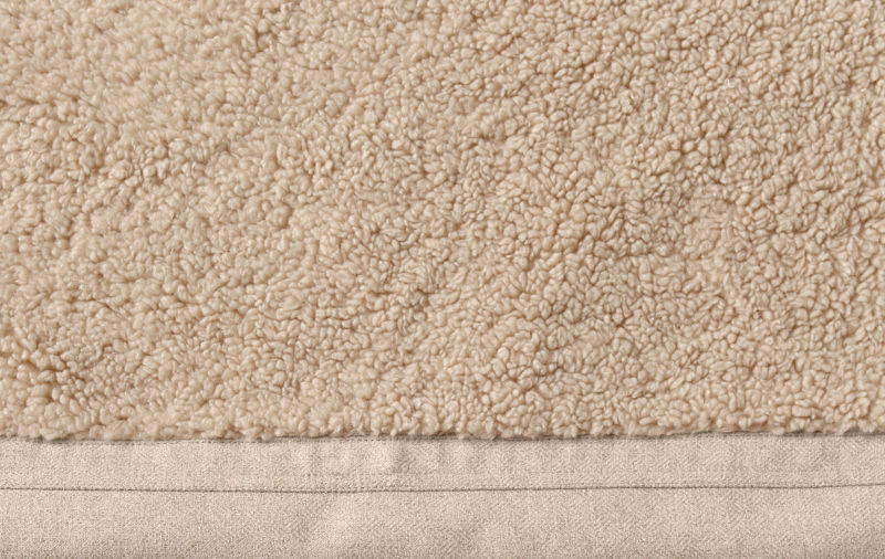 Close-up shot of the beige fleece on a FleeceLock dog bed.