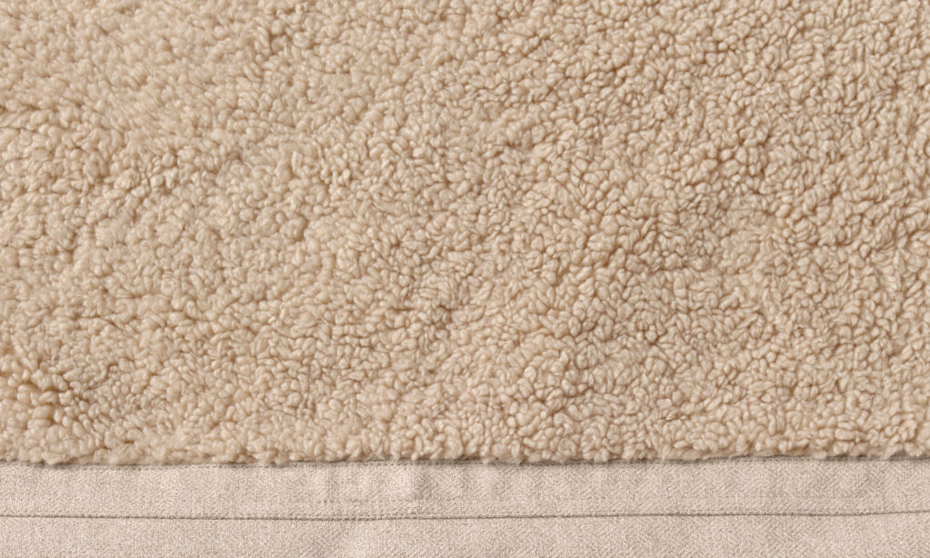 Close-up shot of the beige fleece on a FleeceLock dog bed.