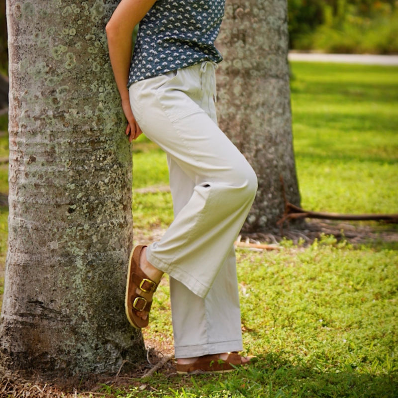 Woman in Explorer Wide-Leg Pants walks through some trees. image number 6