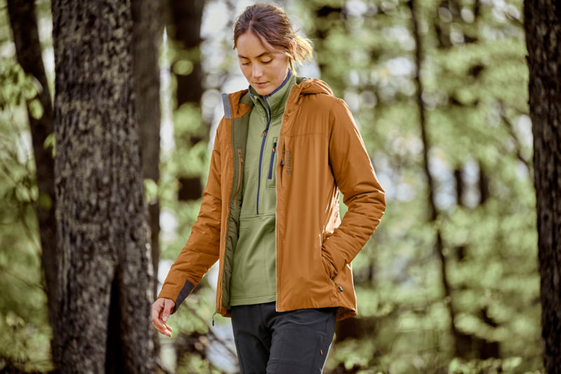 Pro Jacket and horseshoe hills pullover walking through the woods