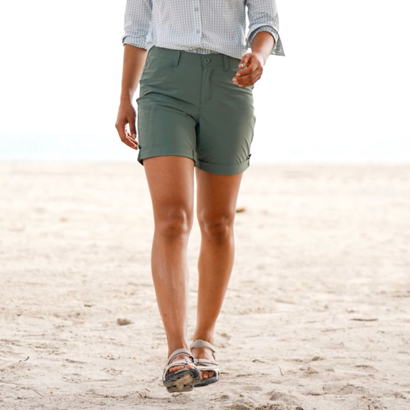 Woman in Jackson Quick-Dry Shorts walks along a beach. image number 4
