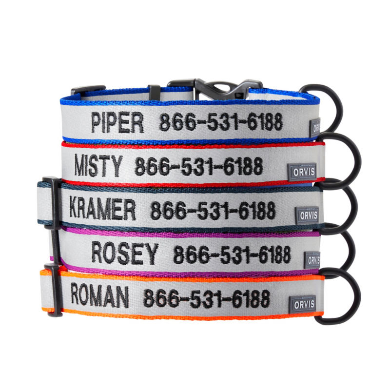 A stack of reflective and personalized dog collars.